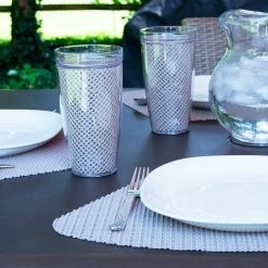 Fishnet 19 in. x 13 in. Tan PVC Covered Jute Wedge Placemat (Set of 6) by Kraftware -Table Linens Shop browns tans kraftware placemats 34149 4f 1000