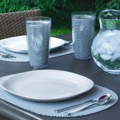 Fishnet 17 in. x 12 in. Ultimate Gray PVC Covered Jute Oval Placemat (Set of 6) by Kraftware -Table Linens Shop grays kraftware placemats 39946 4f 1000