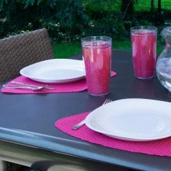 Fishnet 19 in. x 13 in. Pink Yarrow PVC Covered Jute Wedge Placemat (Set of 6) by Kraftware -Table Linens Shop reds pinks kraftware placemats 39449 4f 1000